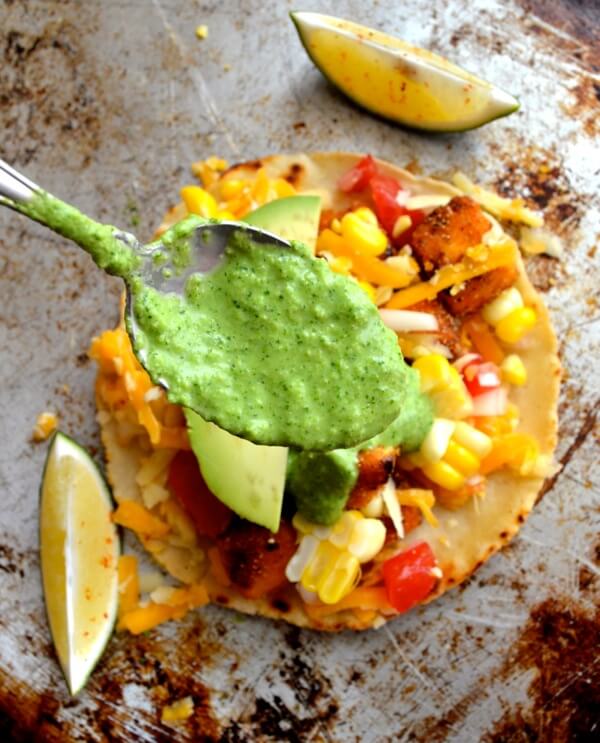 Spooning green sauce over tofu tacos by cwww5.fioekdjsdas.cf
