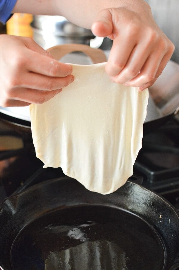 placing thin dough in pan for Jidan Bing, by cwww5.fioekdjsdas.cf