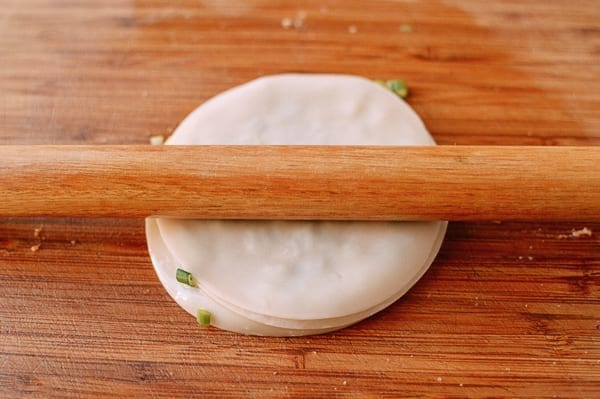 Rolling out scallion pancake made with layered dumpling wrappers, cwww5.fioekdjsdas.cf