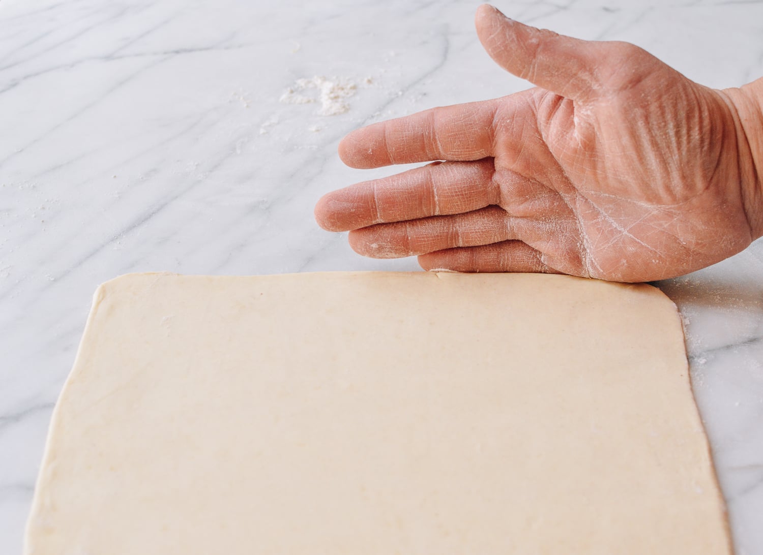 Using hands to straighten pastry edges, cwww5.fioekdjsdas.cf