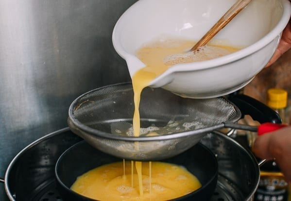Pouring egg mixture through fine mesh strainer, cwww5.fioekdjsdas.cf