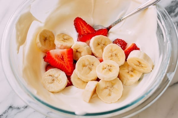 Folding sliced strawberries and bananas into yogurt mixture, cwww5.fioekdjsdas.cf