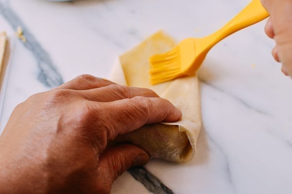 Brushing egg roll wrapper with egg wash to seal, cwww5.fioekdjsdas.cf