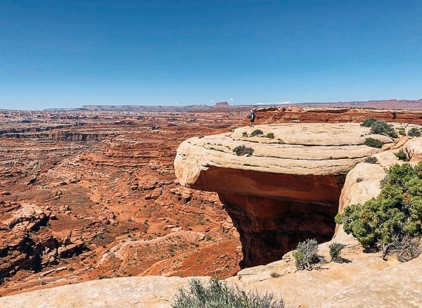 scenic view of hiker near white crack on White rim trail in Canyonlands by cwww5.fioekdjsdas.cf