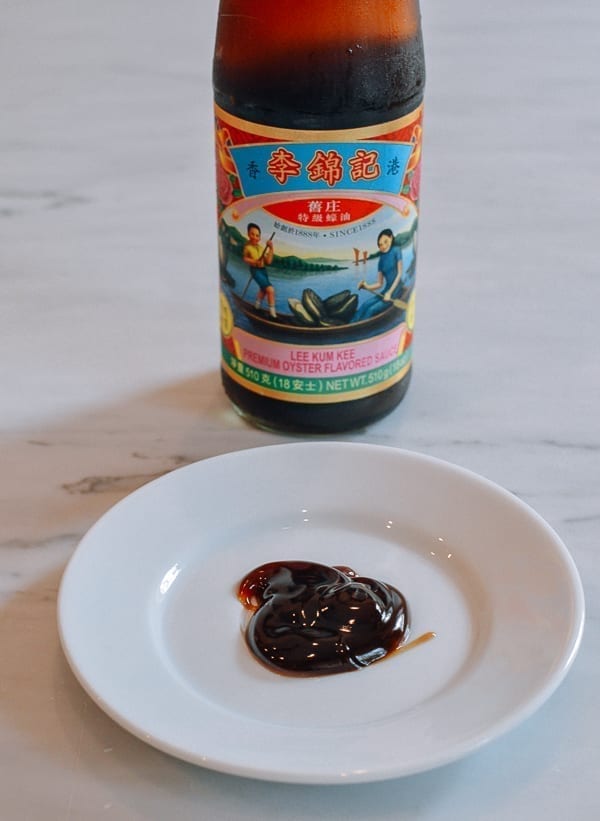Oyster sauce on plate with bottle, cwww5.fioekdjsdas.cf