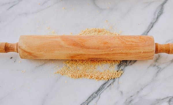 crushing crackers into crumbs with rolling pin, cwww5.fioekdjsdas.cf