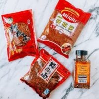 Sichuan chili flakes next to regular crushed red pepper, cwww5.fioekdjsdas.cf