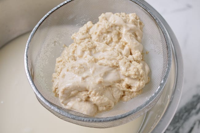 Pouring dough through fine-meshed strainer, cwww5.fioekdjsdas.cf