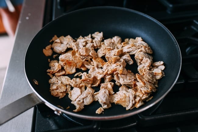 Browning pieces of seitan in nonstick pan, cwww5.fioekdjsdas.cf