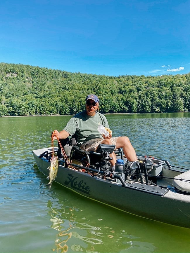 Bill on fishing kayak holding catch, cwww5.fioekdjsdas.cf
