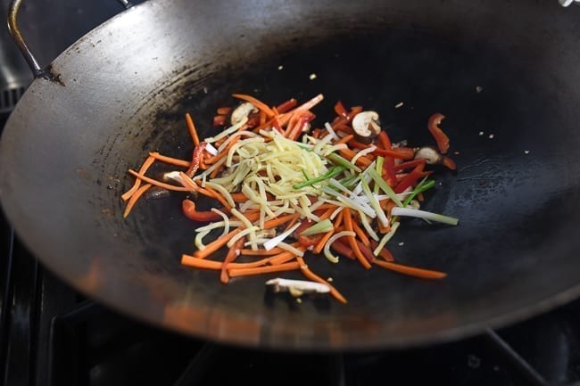 Adding bamboo shoots and white parts of scallions to wok, cwww5.fioekdjsdas.cf