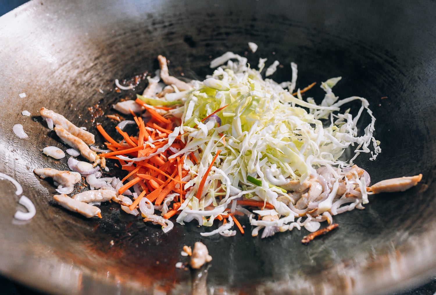 Adding cabbage and carrots to the stir-fry, cwww5.fioekdjsdas.cf