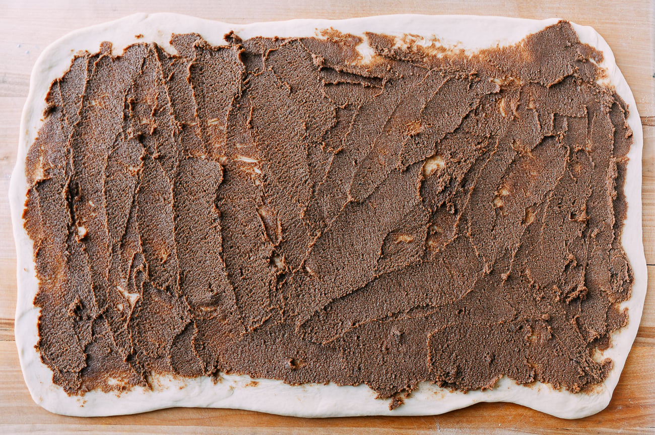 Cinnamon filling spread onto dough