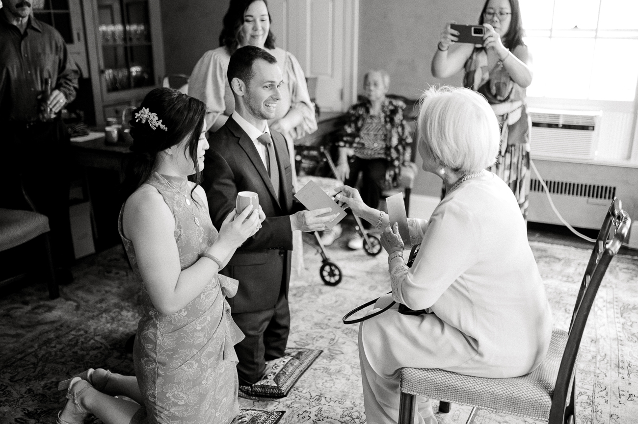 Sarah and Justin receiving a gift from Sarah's grandma