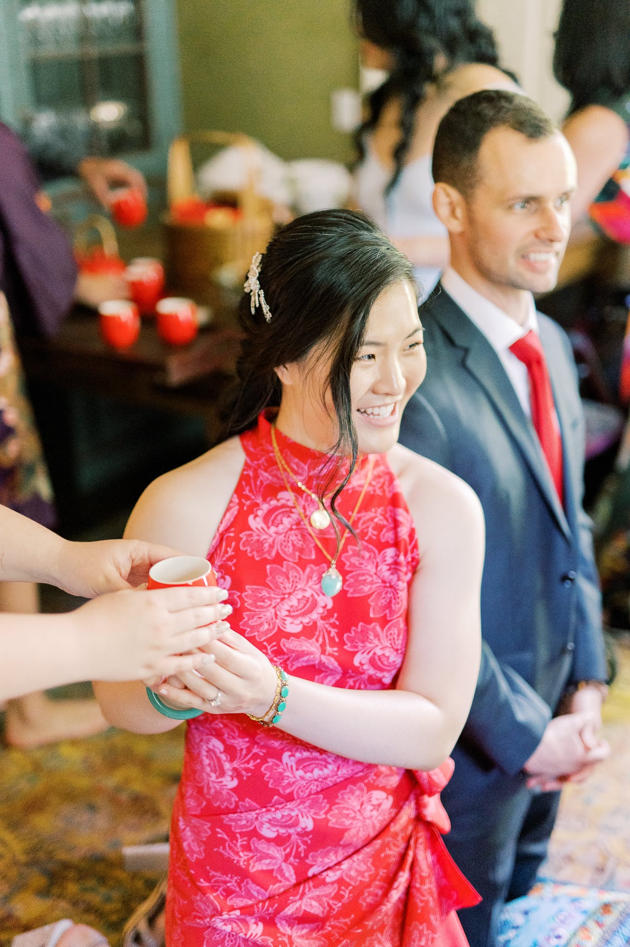 Passing tea to bride during Chinese tea ceremony 