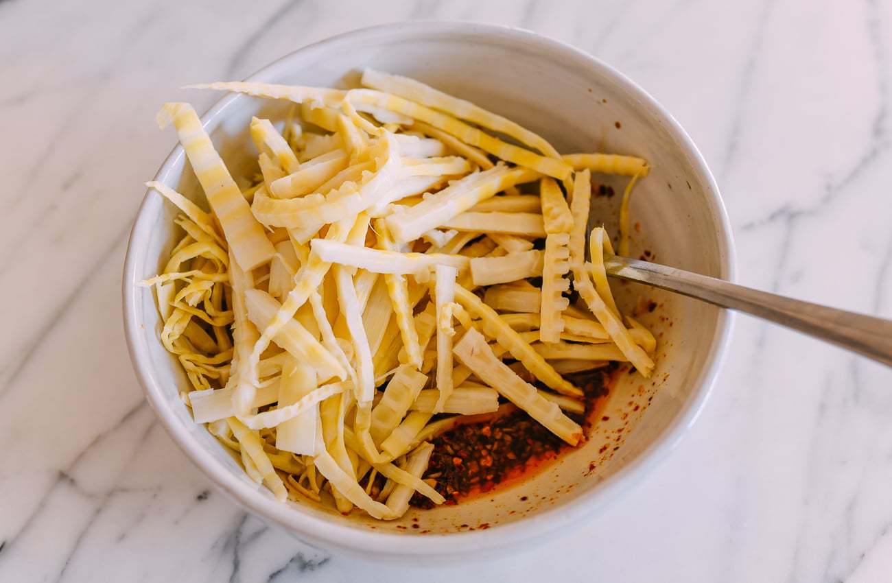 Adding bamboo shoots to dressing