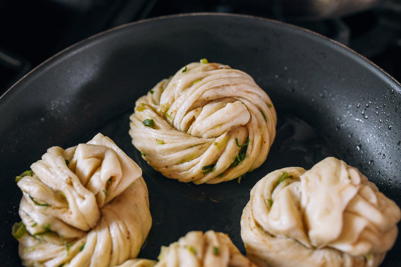 pan-frying steamed bun in nonstick skillet