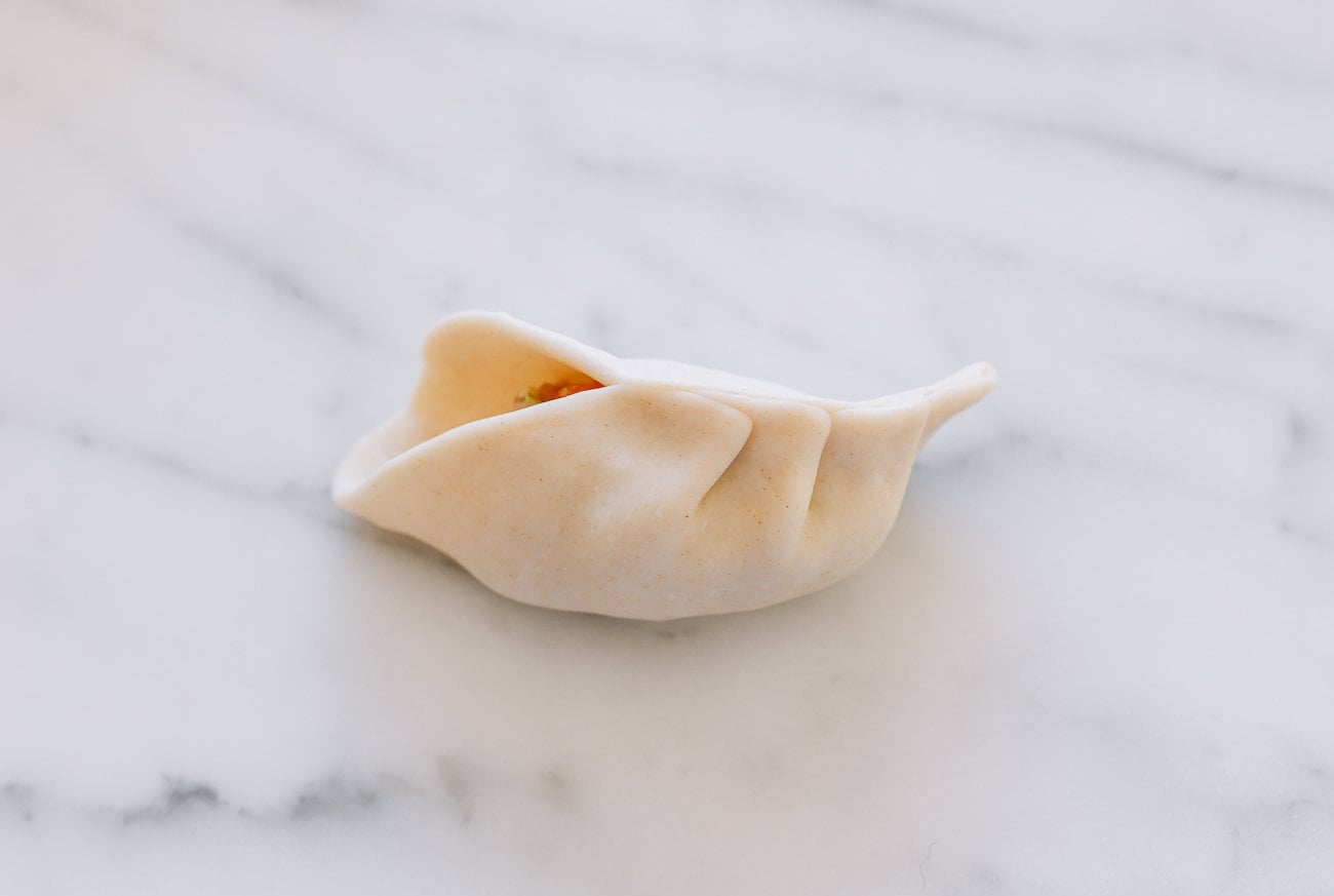 pleating a dumpling