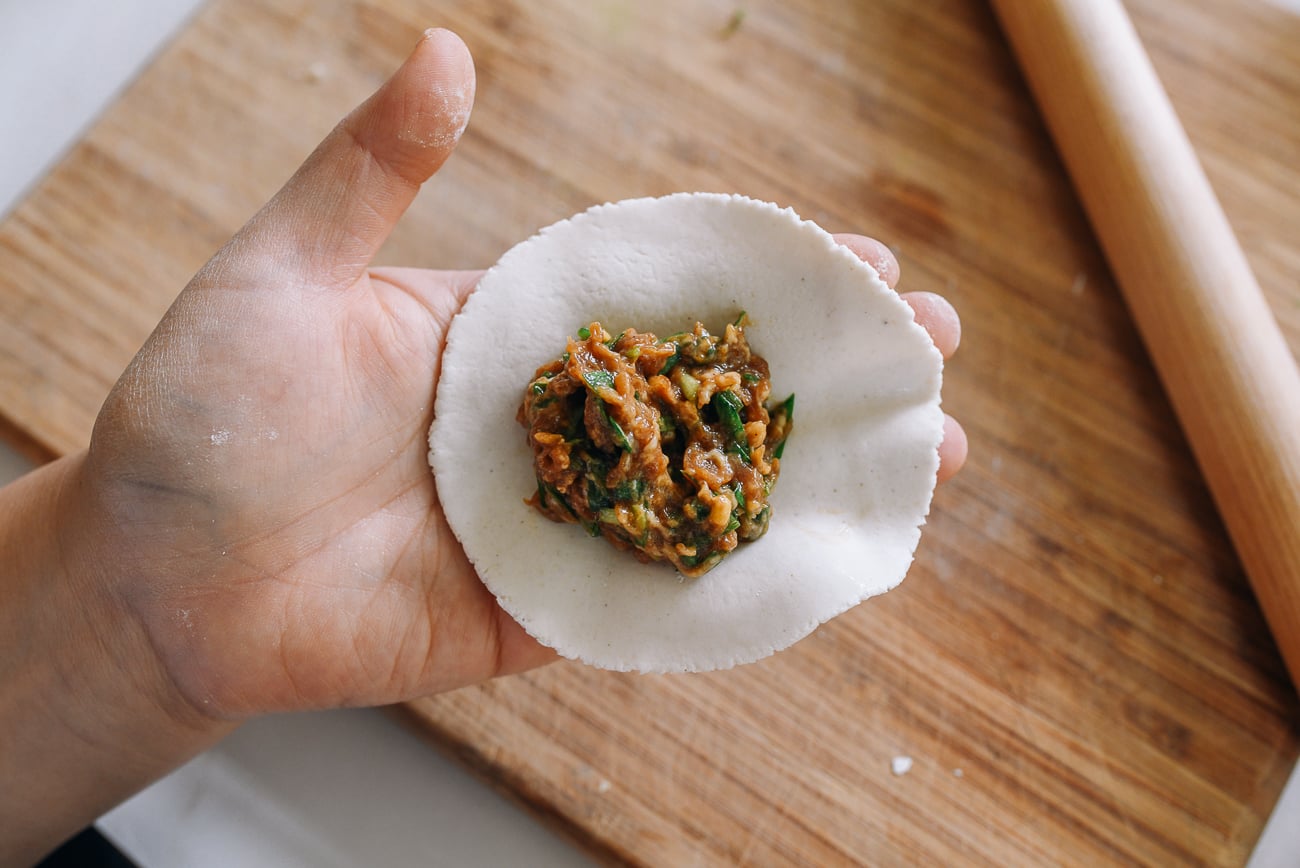 assembling dumplings with gluten-free dumpling wrappers 