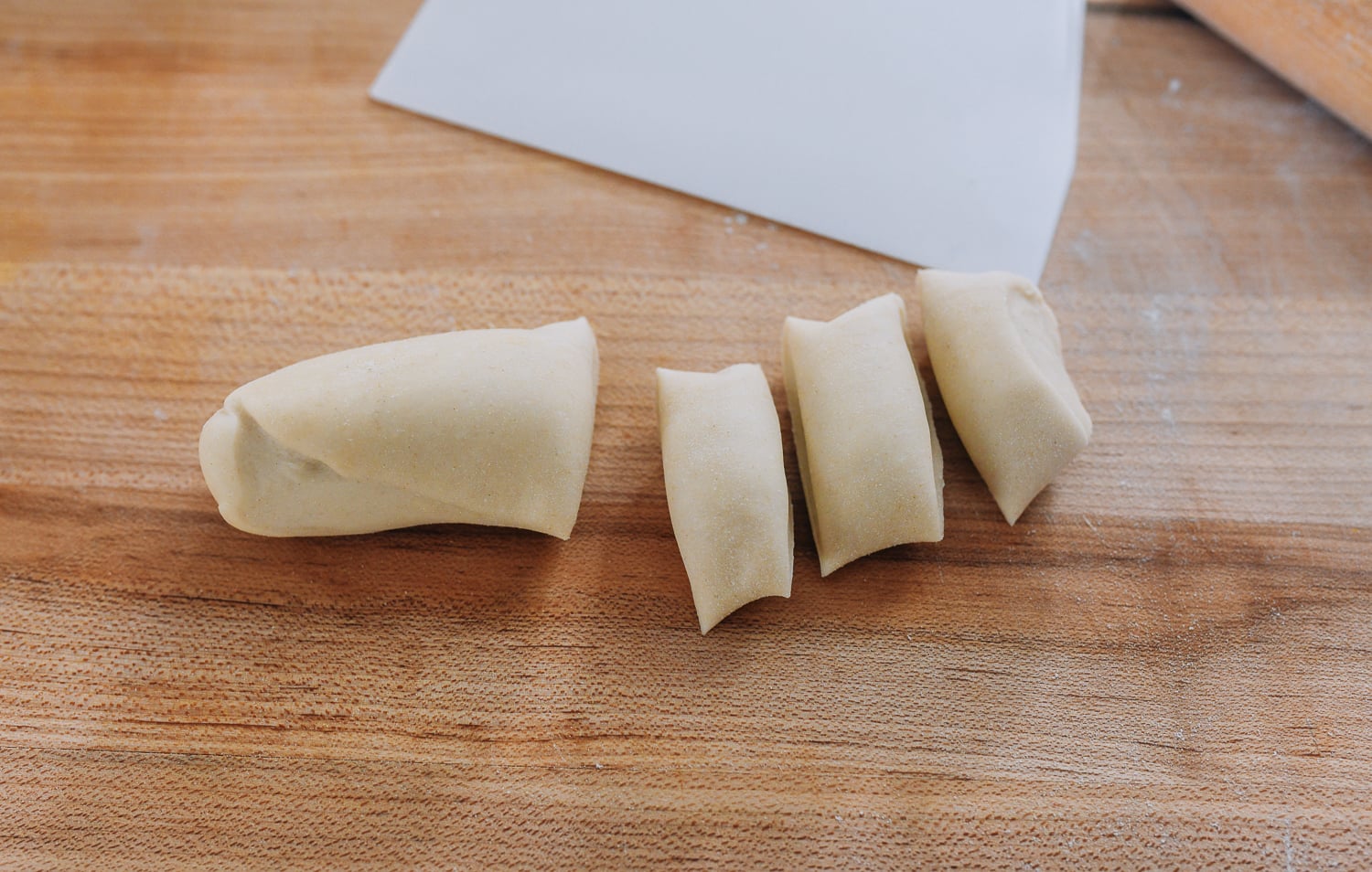 cutting dumpling dough into small pieces