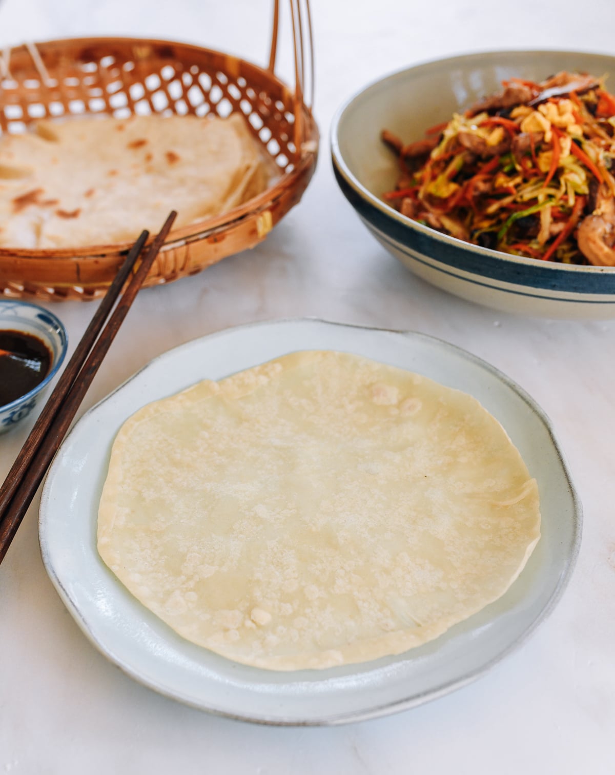 moo shu pancake on plate with moo shu pork