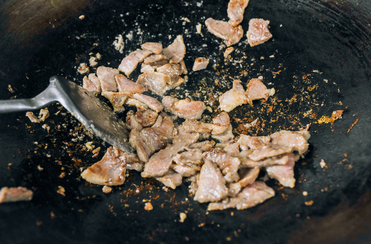 seared sliced pork in wok