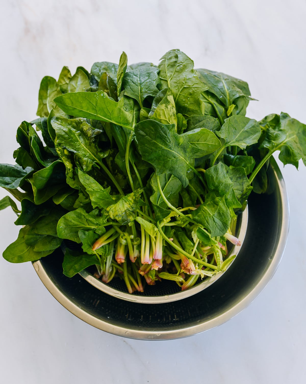 washed spinach in colander