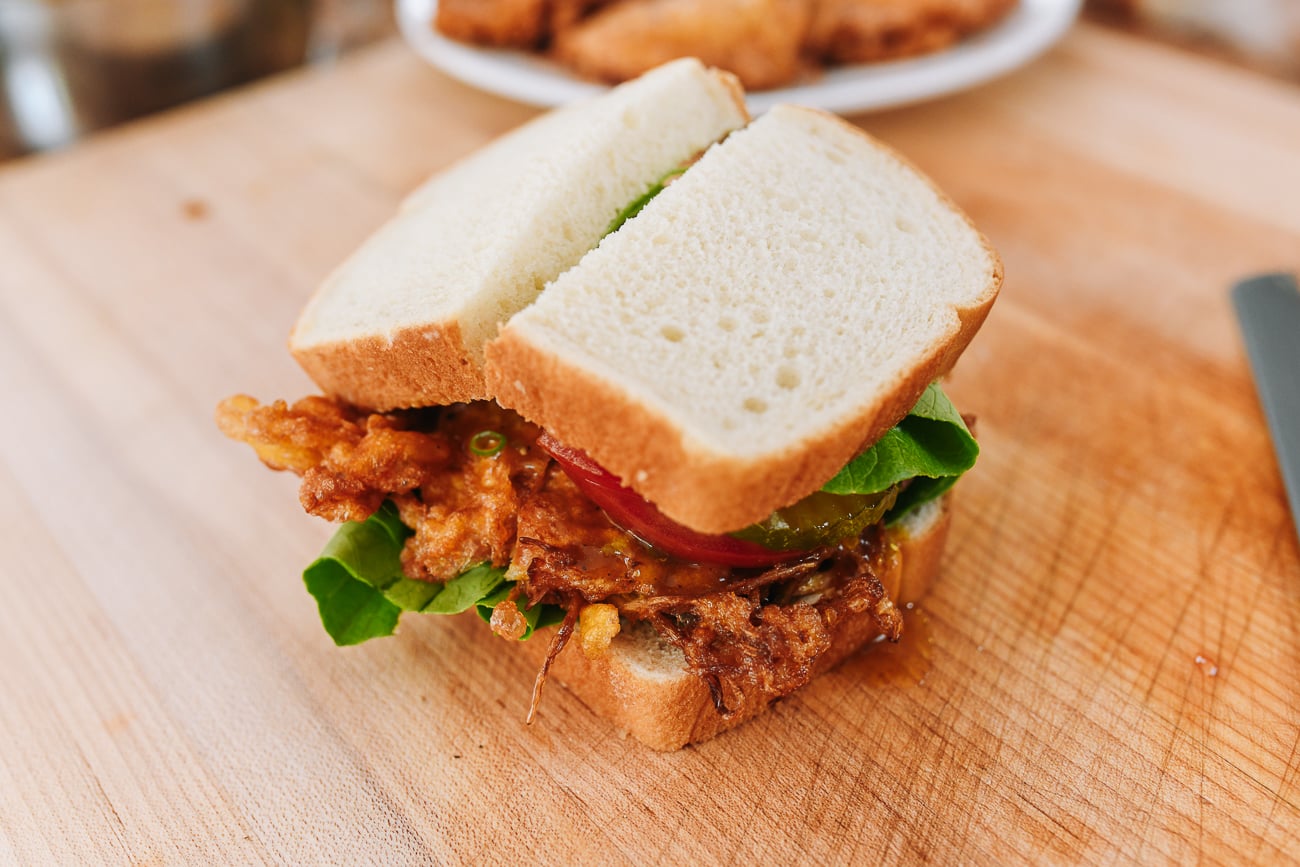 St. Paul Sandwich cut in half on cutting board
